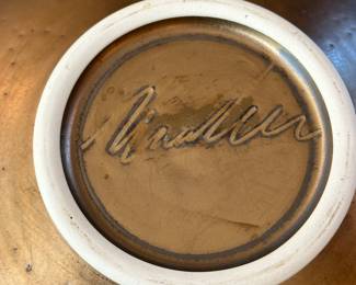 Artist Signature of the Wall Hanging Ceramic Piece.