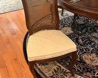 Detailed View of the Henredon Cane Back Chair, Upholstered in an Ivory Embroidered Pattern.