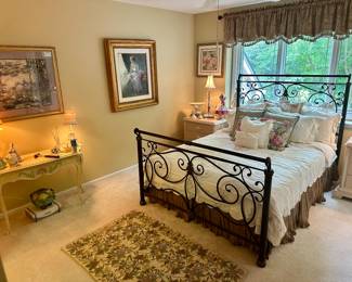 Enter a Pretty, Feminine Bedroom Featuring a Queen Size Iron Bed Frame, with Vintage Linens and Decor.