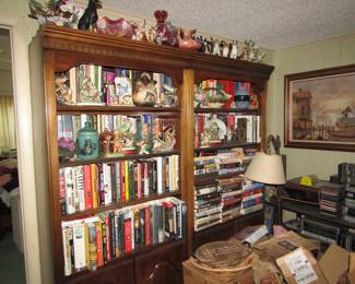 shelving with more books, collectible dog statues