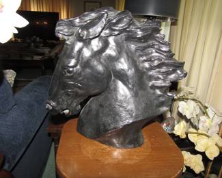 signed horse head statue