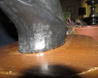 signature on horse head statue