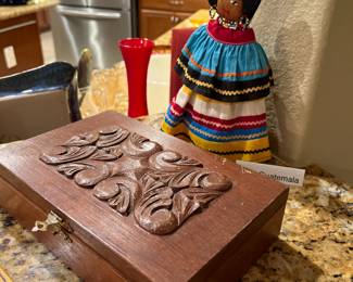 Box of wooden dominoes and our favorite doll.