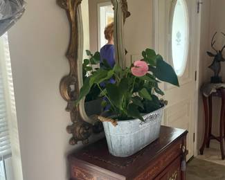 Ornate mirror . Cabinet with inlay design