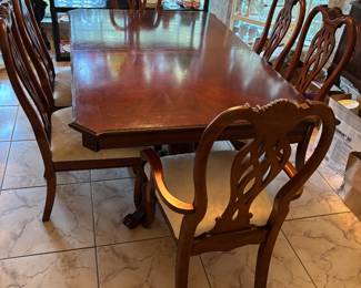 Dining room table with 2 Captains chairs, 4 side chairs and 2 18” leaves. $550