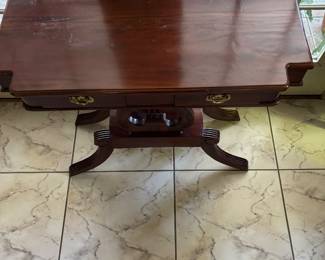 Harp base pedestal table, dark mahogany, 2 small drawers. 32 tall, 35 wide, 17 deep. $225