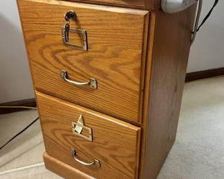 2 drawer, key lock wood file cabinet with power strip $35
