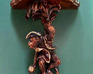 Pair of carved monkey sconces
