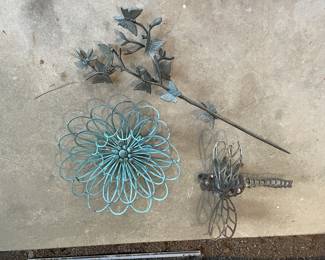 Metal Garden Decor-Dragonfly Sculpture, Circular Flower like sculpture, and a branch like piece adorned with butterflies.