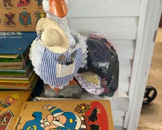 Porch goose with bag of clothes -