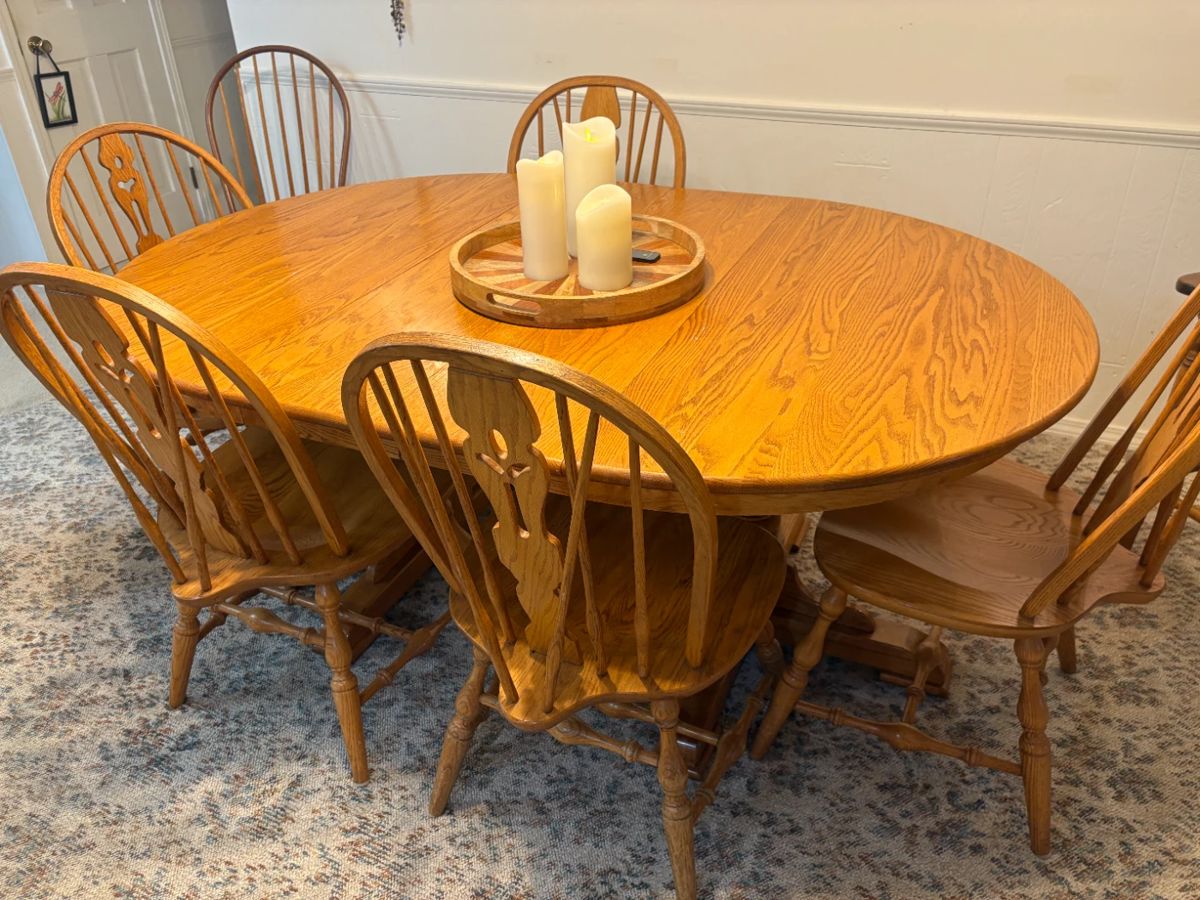 . . . solid oak Amish-style dining room table and chairs