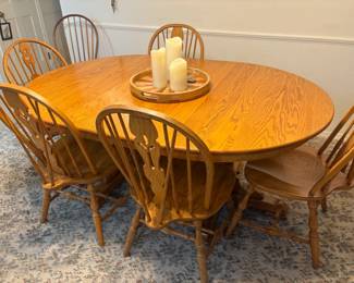 . . . solid oak Amish-style dining room table and chairs