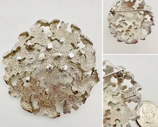 A signed Crown Trifari abstract coral reef silver tone brooch