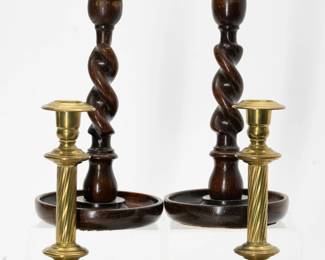 A wonderful pair of antique turned wood barley twist candlestick holders with brass tops, and a pair of Townshend and Thompson antique brass candleholders
