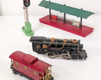 Vintage Lionel pre-war American Flyer locomotive 420, a Lionel Lines O Scale Prewar Tinplate 657 Caboose, Lionel green roof station platform, and a
Lionel No. 153 Automatic Block Signal Control
