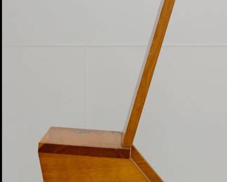 A side view of one of the four matching wooden chairs by artist Bill Crowe, signed and dated '94. Overall height 46 inches, L 24 inches, Height to seat 16 inches, width 16 inches