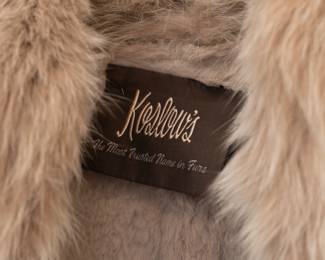 Closeup of the vintage Christian Dior fur lined belted long coat with fur shawl collar and trim