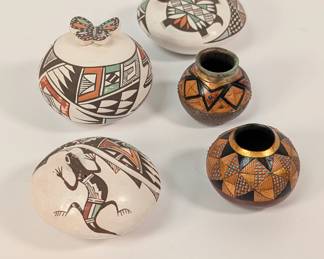 Vibrant Southwestern pottery including hand painted jars with three-dimensional buttery fly and turtle lids, signed by Acoma Pueblo potter Sharon Lewis; and two Geometrics Series incised and painted gourds by American fine artist Bill Colligen