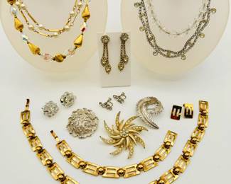 More stylish costume jewelry from our warehouse sale including a Dafoe parure of gold tone large link bracelet, necklace and earrings; a vintage Sarah Coventry gold tone and crystal rhinestone starburst or pinwheel brooch, a signed Crown Trifari abstract coral reef silver tone brooch, a 40s/50s rhinestone necklace and pair of rhinestone dangle earrings, and a gorgeous gold tone bead and AB crystal bead necklace comprised of pear-shaped gold tone brushed metal beads interspersed with pear-shaped faceted AB crystals