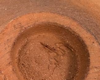 Closeup of the Modernist mica clay smoked fired vessel w/ bronze lid, signed Carol Green; and a southwestern pottery geometric pattern jar