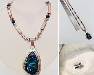 Bold Native American design from Navajo silversmith Oliver Smith. The sterling silver and stone beaded necklace terminates in a gorgeous azurite and malachite cabochon set in sterling silver.