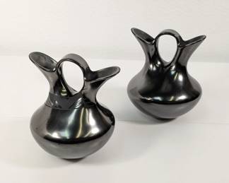 A beautiful pair of Mata Ortiz pottery wedding vases by artist Martin Olivas. Mata Ortiz in Chihuahua, Mexico is world-renowned for its unique, handmade pottery, which revives a pre-Hispanic ceramic tradition.