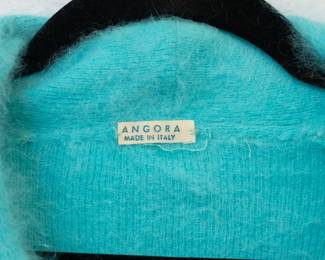 Closeup of the aqua color angora pullover sweater, made in Italy