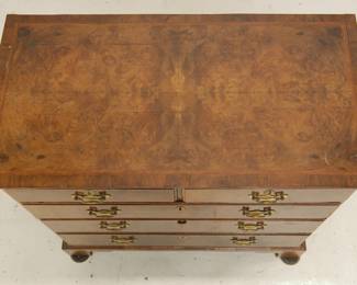 18th Century Georgian Burled Walnut Chest of Drawers Featuring five drawers and simple ogee bracket feet. Bookmatched burled veneer on top surface with inlaid marquetry border; drawer fronts with inlaid strips framing burled wood veneer. Brass escutcheons with swan neck handles.