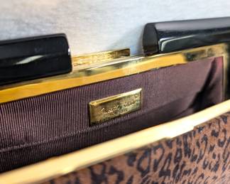 Closeup of Judith Leiber leopard print clutch purse