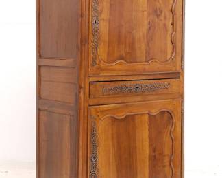 An antique wooden two-door cupboard with locking center drawer (with key)