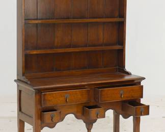 Another view of the Welsh dresser, 2 parts: the dresser base has an open pot board and 5 drawers (two wide and three small); the dresser top has cornice top with front scalloped edge and two fixed shelves (or plate groove) for displaying dishware. Replacement pulls. The style dates back to the early 1600s.