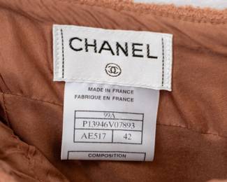 Closeup of the vintage 1990s Chanel orange ruffle hem skirt, size 42, made in France