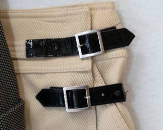 Closeup of the Chanel beige cotton twill with black patent strap buckle wrap skirt, size 38, made in Italy