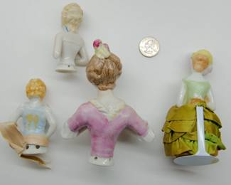 Reverse view of the antique porcelain half dolls