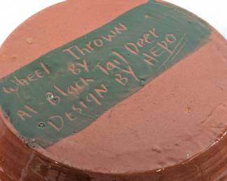 Base of the vintage wheel-thrown hand painted Sioux pottery vase signed by Al Black Tail Deer