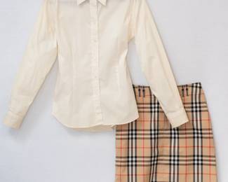 A Burberry London cream color button front blouse, size M, with a Burberry London plaid short skirt
