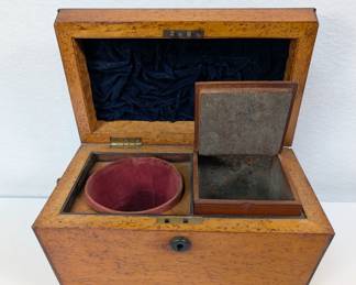 Early 19th century tea caddy, a coffer form birds eye maple veneered caddy with divided interior