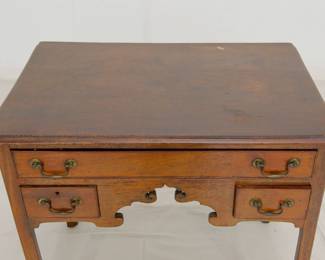 Another view of the Chippendale Style Oak Mahogany Lowboy or Dressing Table, rectangular top with molded edge, three molded edge drawers, scalloped skirt, raised on straight square legs with molded edge.