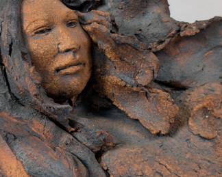 Closeup of vintage signed Jean Juhlin Native American figure abstract stoneware sculpture