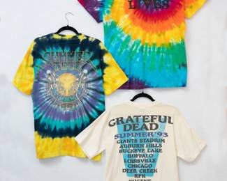 Reverse view of the Grateful Dead 1991 Summer Tour tie-dye t-shirt, Grateful Dead Jerry Lives t-shirt, and Grateful Dead 1993 Summer Tour t-shirt