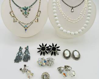A sweet selection of vintage costume jewelry necklaces, earrings and brooches