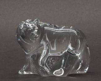 Steuben Glass Kodiak Bear Figurine. Sleekly rendered in mid stride, this handmade Steuben art glass Kodiak Bear figurine was designed by Taf Lebel Schaefer and introduced in 2011. Signed Steuben on the underside and measuring 4-1/2 inches L x 2 inches W x 3-1/2 inches H.