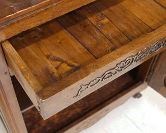 An antique wooden two-door cupboard with locking center drawer (with key)
