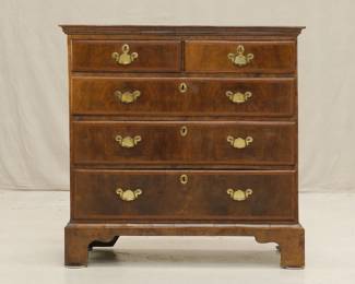 18th Century Georgian Burled Walnut Chest of Drawers Featuring five drawers and simple ogee bracket feet. Bookmatched burled veneer on top surface with inlaid marquetry border; drawer fronts with inlaid strips framing burled wood veneer. Brass escutcheons with swan neck handles.