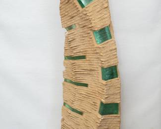A striking abstract carved limestone and inset glass sculpture, signed; 52 inches tall