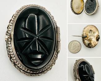 A Mexican silver and carved onyx locket brooch