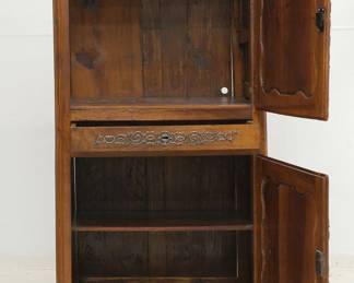 An antique wooden two-door cupboard with locking center drawer (with key)