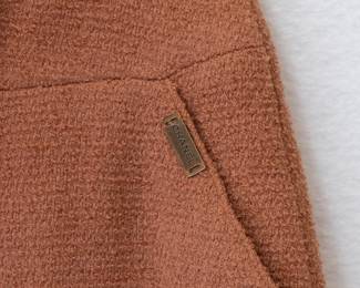 Closeup of the vintage 1990s Chanel orange ruffle hem skirt, size 42, made in France