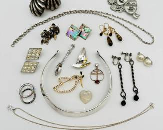 Mostly silver tone costume jewelry with some rhinestones sprinkled throughout, and a strikingly simple collar from Danish jeweler Erik Dennung