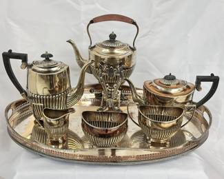 A vintage English IFS Ltd Israel Freeman & Son Ltd Art Deco style silver plated tea set by including hot water kettle with spirit heater, a coffee pot, teapot, waste bowl, sugar bowl; along with a silver plated tea tray or butler's tray with galleried rim